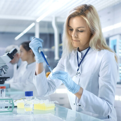 GMP quality control laboratory scientist preparing monoclonal antibody samples for protein concentration analysis using SoloVPE slope spectroscopy with variable pathlength technology.