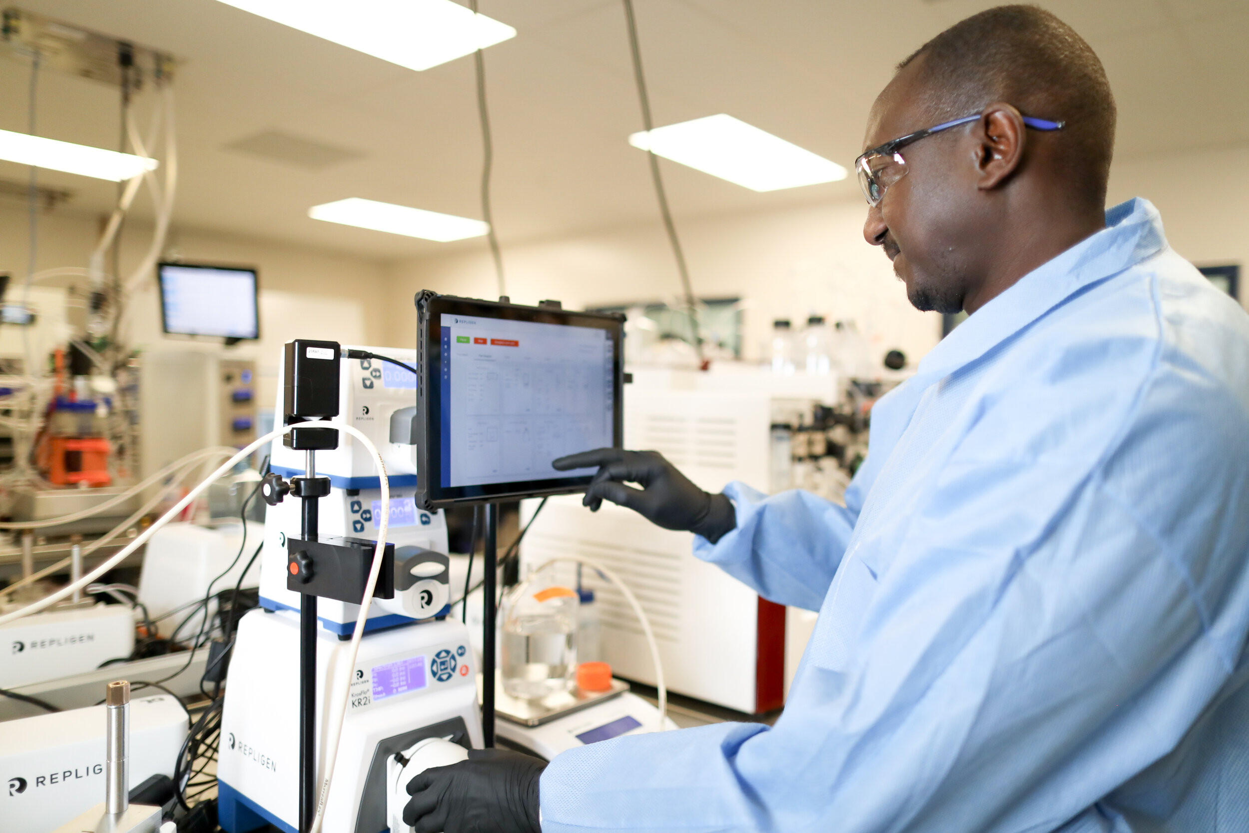 Process engineer reviewing data on KrosFlo KR2i TFF system