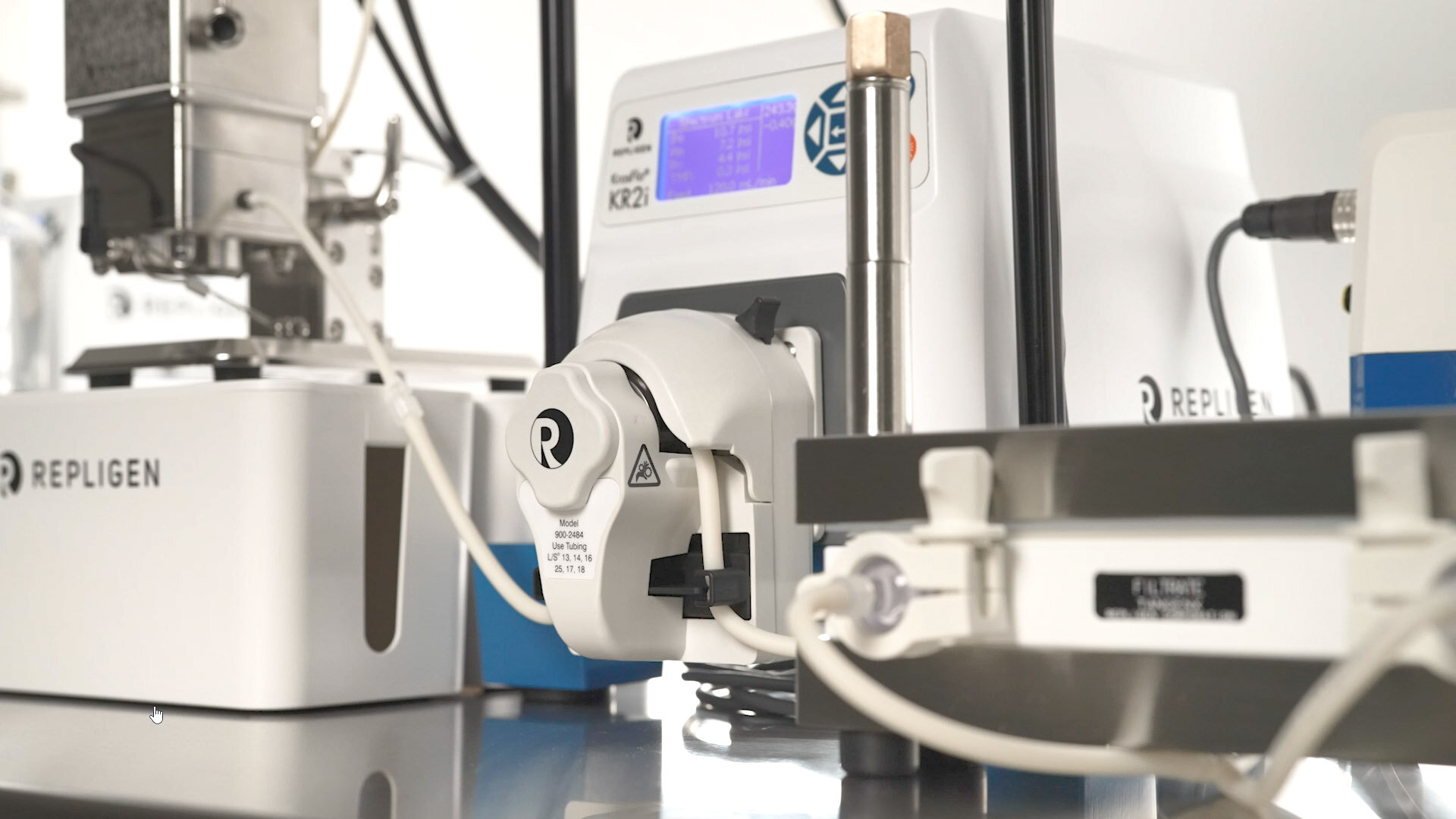 A close-up image of a pump of a tangential flow filtration (TFF) system, the KrosFlo RPM System, that integrates in-line, UV-Vis protein concentration measurements, in order to achieve real-time process management, and utilizes process analytical technology (PAT) to better monitor, control, and automate the TFF process.